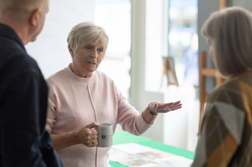 Woman swapping stories with others