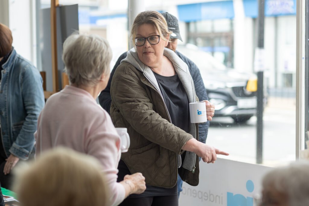 Women looking at photos and swapping stories