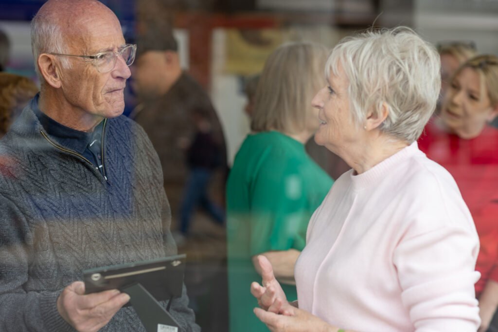 A man and woman swapping stories