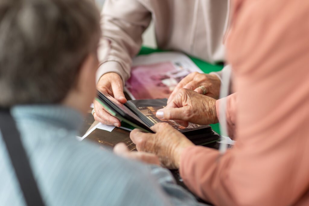 Women looking at photos and swapping stories